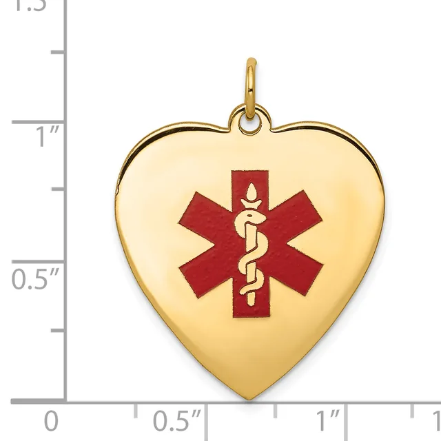 Gold heart-shaped medical alert pendant with red enamel Star of Life symbol and snake staff, shown next to a ruler measuring approximately one inch wide.