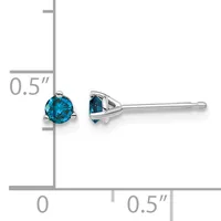 A pair of silver stud earrings with round blue gemstones shown next to a ruler indicating they are approximately 0.5 inches in diameter.