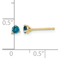A pair of gold stud earrings with round blue gemstones, shown next to a measurement ruler indicating approximately 0.5 inches in diameter.