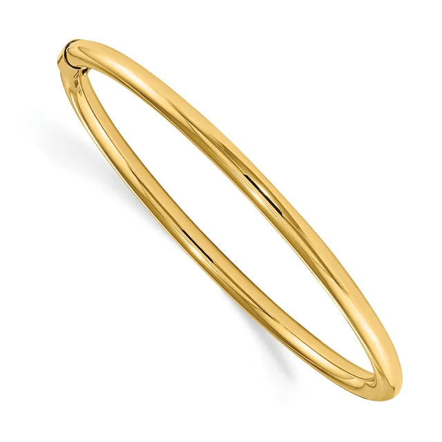 A polished gold-toned bangle bracelet with a hinged clasp, displayed at an angle against a white background.