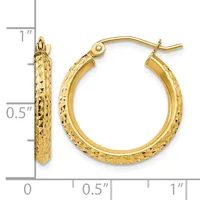 Gold textured hoop earrings with a hammered surface finish, shown next to a ruler displaying their size of approximately one inch in diameter.