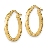 A pair of gold hoop earrings with a textured, segmented surface and post closures, displayed against a white background.