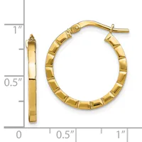 Polished gold-tone hoop earrings with textured segmented surface and post backs, shown next to a measurement ruler indicating approximately one inch in diameter.