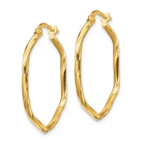 A pair of gold oval hoop earrings with a polished finish and hinged closures, displayed against a white background.