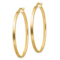 A pair of gold hoop earrings with a textured finish and hinged closure posts, displayed side by side.