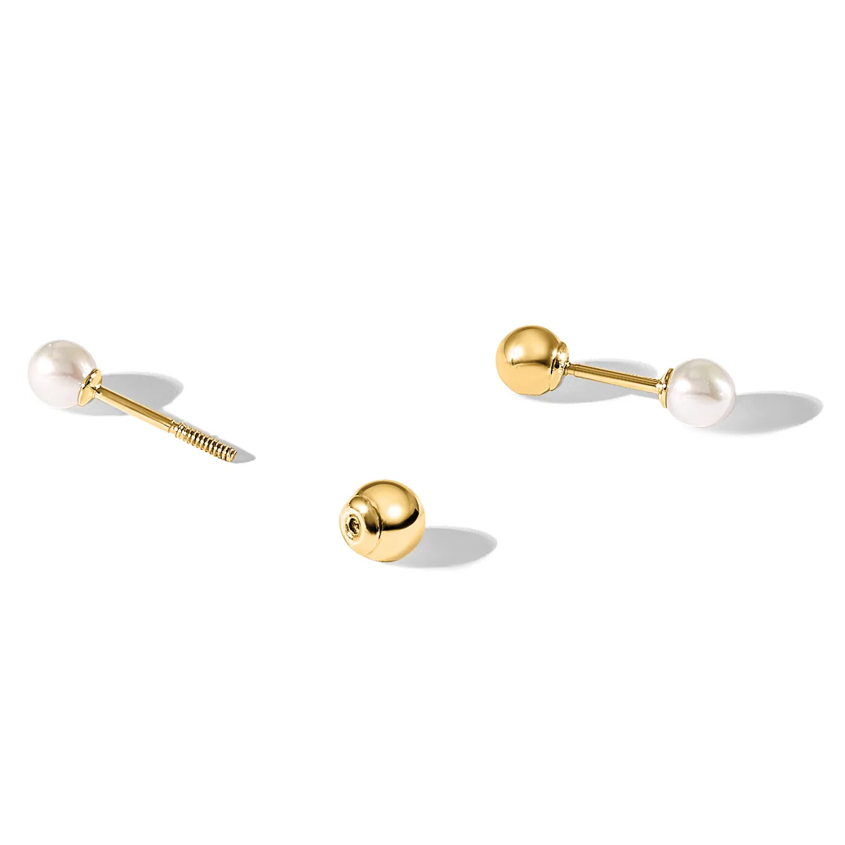 Three brass cabinet knobs with white pearl finials, shown disassembled with screws and mounting hardware on a white surface.