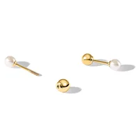 Three brass cabinet knobs with white pearl finials, shown disassembled with screws and mounting hardware on a white surface.