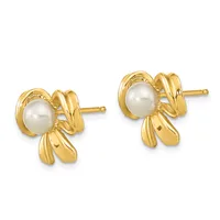 A pair of gold stud earrings with pearl centers surrounded by decorative bow-shaped gold settings.