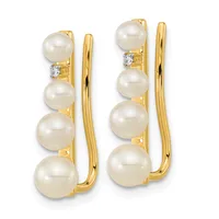 Pair of gold earrings with four cream-colored pearls graduated in size down each earring and small diamond accents, shown from the front.