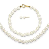 A gold-clasp bracelet and matching stud earrings made of white pearl beads arranged in a row.