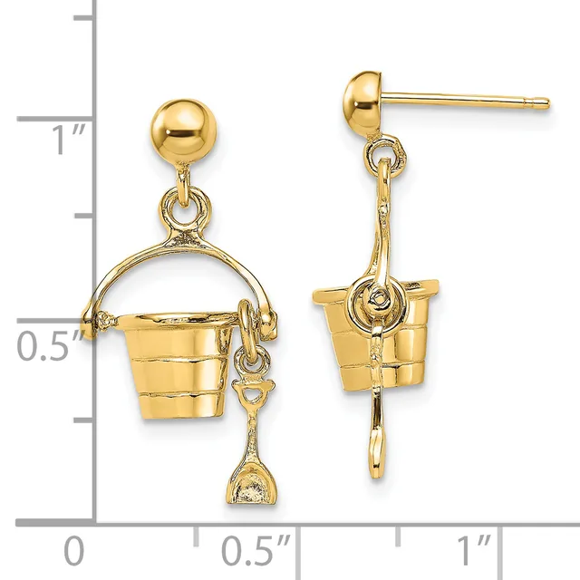 Pair of gold-toned drop earrings featuring ball studs with bucket-shaped charms suspended by decorative loops, shown next to a measurement ruler.
