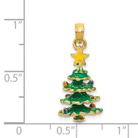 Gold-toned Christmas tree pendant with green enamel, colorful gemstone accents, and a gold star on top, shown next to a ruler measuring approximately one inch in length.