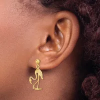 A gold-toned meerkat-shaped dangle earring hangs from a ball stud on a person's earlobe.