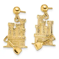 Pair of gold dangle earrings featuring sandcastle charms with textured finish and small shovels attached, suspended from polished ball studs.