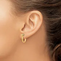 A person wearing a gold hoop earring with a small diamond or crystal stone stud, shown from the side profile of their ear and neck.