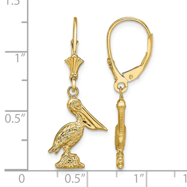 A pair of gold lever-back earrings with pelican charms hanging from decorative wire posts, displayed next to a measurement scale.