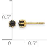 A pair of gold stud earrings with round black onyx stones set in prong settings, shown next to a measurement ruler indicating approximately 0.5 inches in length.
