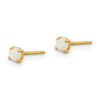 A pair of gold stud earrings with round pale opalescent stones set in four-prong gold settings, displayed against a white background.