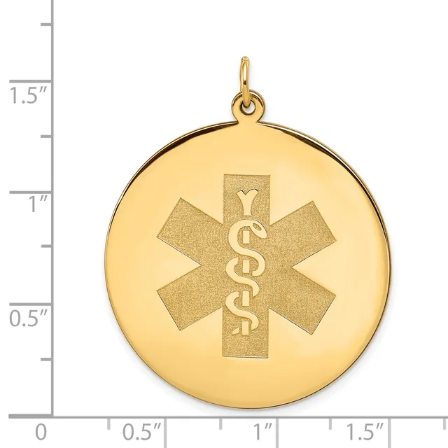Gold-colored round medical alert pendant with a star of life symbol and engraved serpent staff, shown with a scale indicating approximately 1.25 inches in diameter.