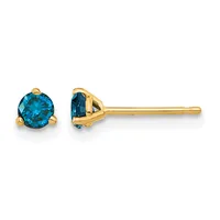 A pair of yellow gold stud earrings featuring round blue topaz stones set in three-prong settings, shown from front and side views.