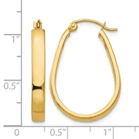 Polished gold-toned hoop earrings with oval shape shown next to a measurement scale indicating approximately one inch in length.