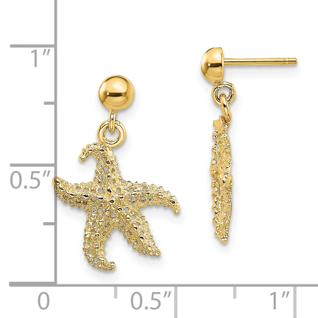 Gold starfish dangle earrings with ball studs shown next to a measurement ruler indicating approximately one inch in length.