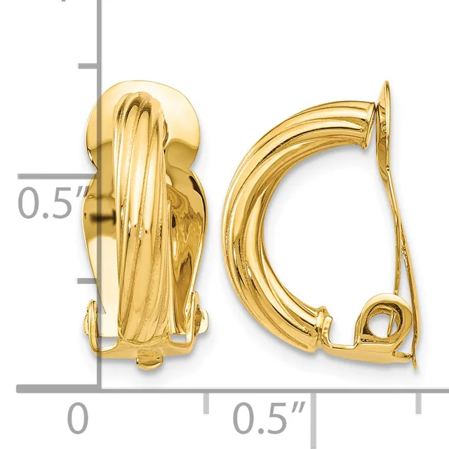 Two gold-toned curved clip-on earrings with ribbed texture and polished finish, shown at actual size against a measurement scale.