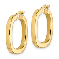A pair of polished gold hollow hoop earrings with rounded rectangular shapes and clip-on closures, shown against a white background.