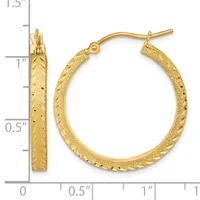 A pair of gold textured hoop earrings with a hammered finish and hinged posts, shown against a measurement scale indicating approximately one inch in diameter.