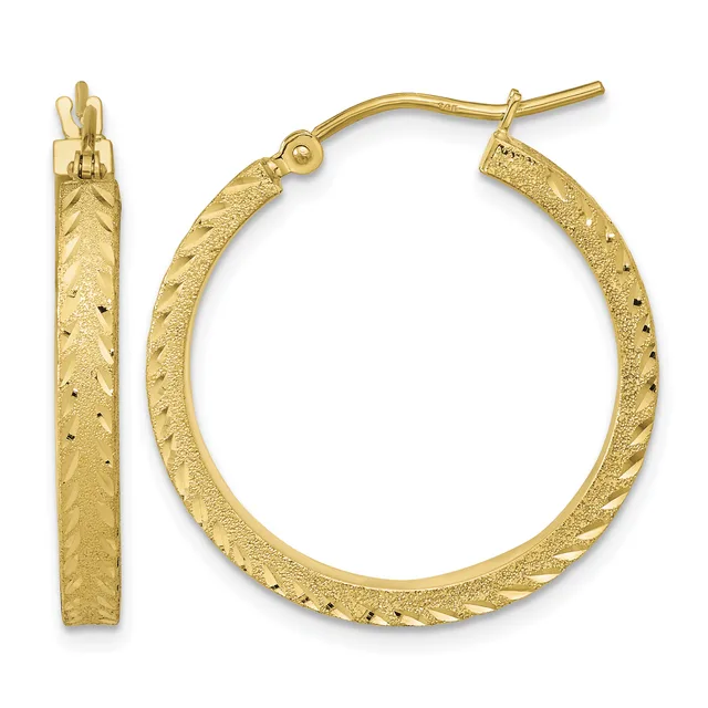 Pair of gold hoop earrings with textured finish and small decorative dots, shown from front and side views.