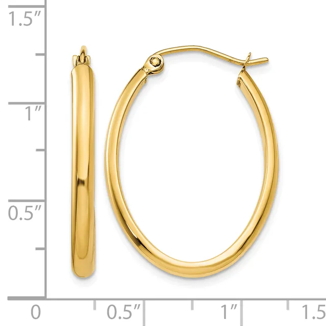 Pair of polished gold-toned oval hoop earrings with post and clutch closures, shown next to a measurement scale indicating approximately 1.25 inches in length.
