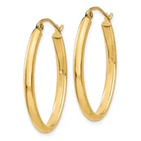 A pair of polished gold-toned oval hoop earrings with hinged closures, displayed side by side against a white background.