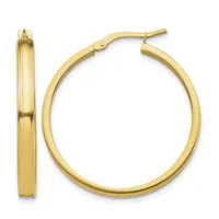 A pair of polished gold hoop earrings shown from the front and side views, displaying their smooth, rounded rectangular profile and hinged post closures.