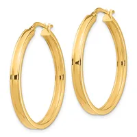 A pair of polished gold hoop earrings with a ridged texture, shown against a white background.