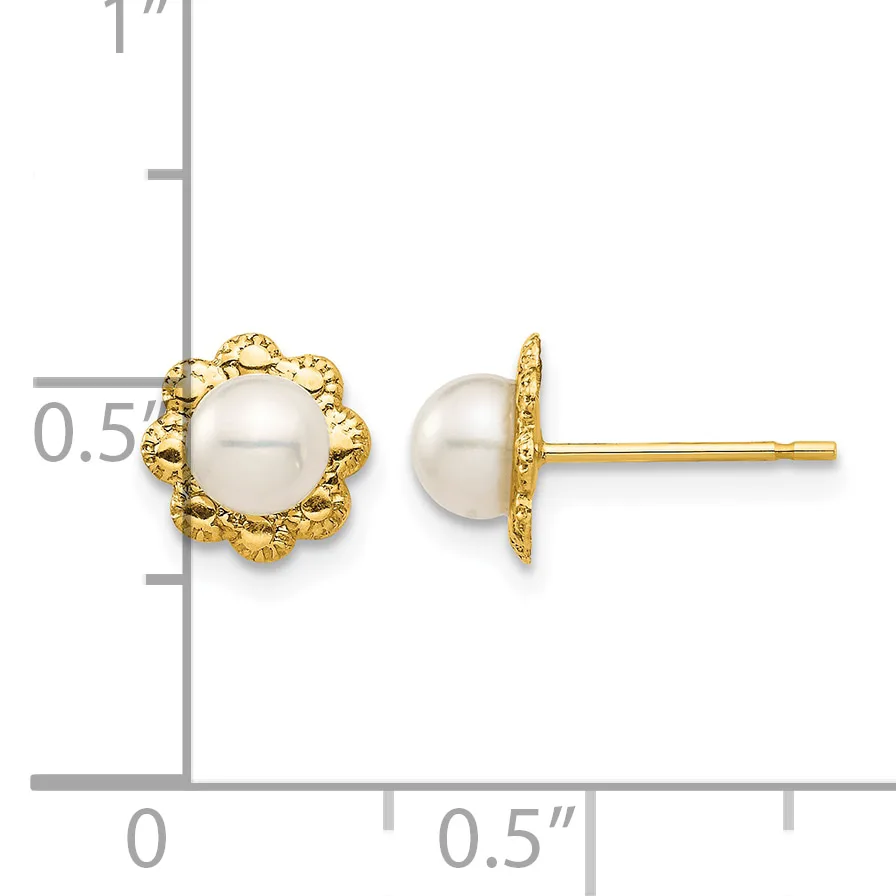 Pair of gold stud earrings featuring white pearl centers surrounded by textured gold flower-shaped settings, shown next to a ruler for scale.