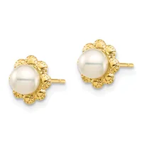 A pair of gold stud earrings, each featuring a round white pearl surrounded by an ornate textured gold floral-shaped setting.