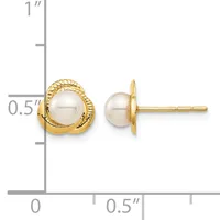 Two gold stud earrings with cream-colored pearl centers displayed next to a ruler showing approximately 0.5 inches in height.