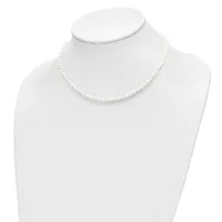 A white pearl necklace displayed on a white mannequin bust against a white background.