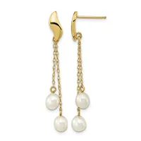 Pair of gold drop earrings with curved top posts and delicate chains suspending two cream-colored pearls on each earring.