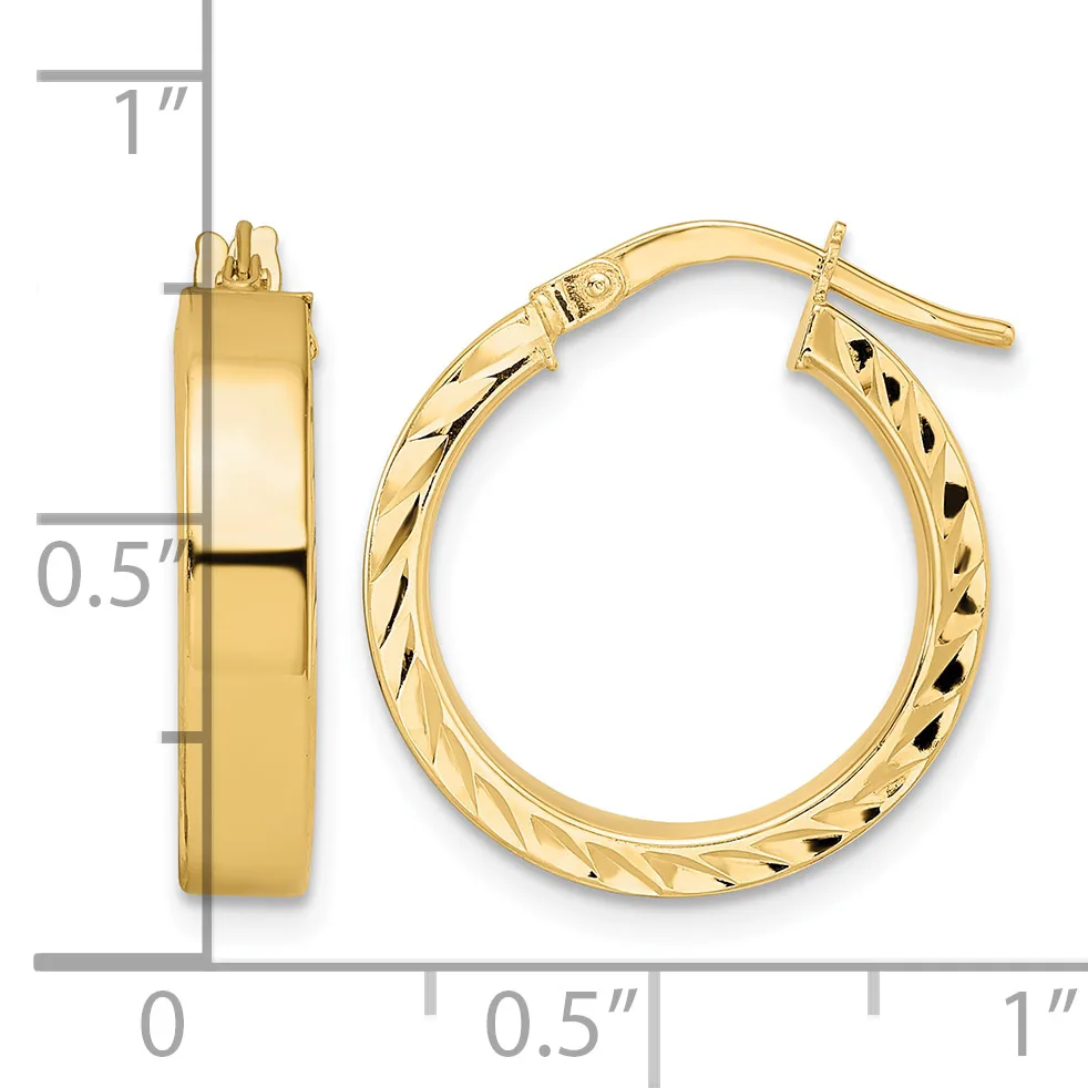 A pair of gold hoop earrings with a polished finish and textured inner surface, displayed against a measurement scale showing approximately one inch in length.