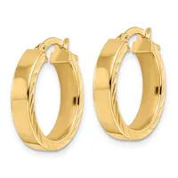 A pair of polished gold hoop earrings with twisted detailing on the inner surface, displayed side by side against a white background.