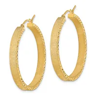 Pair of textured gold hoop earrings with hammered surfaces and decorative edges, displayed side by side.