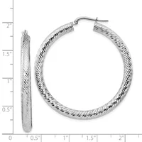 Pair of silver-toned twisted hoop earrings with post and clutch backs, displayed against a measurement ruler showing approximately 1.5 inches in diameter.