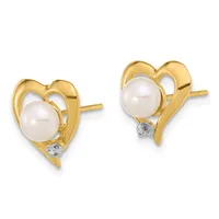 A pair of gold heart-shaped stud earrings, each featuring a white pearl in the center with a small diamond accent at the bottom.