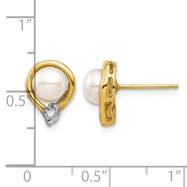 Pair of gold stud earrings featuring white pearl tops with small diamond accents at the base, shown next to a measurement scale.