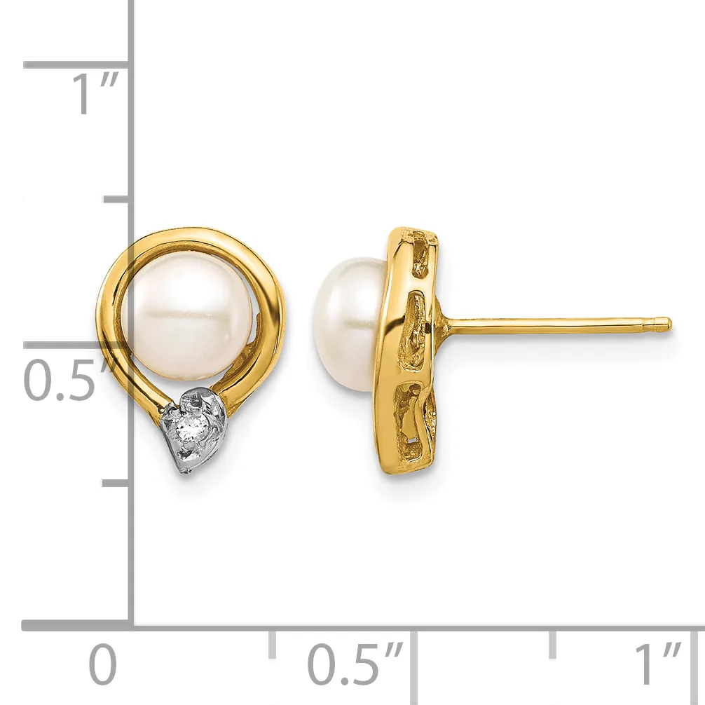 Pair of gold stud earrings featuring white pearl tops with small diamond accents at the base, shown next to a measurement scale.