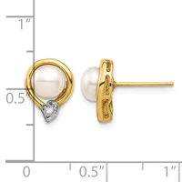 Pair of gold stud earrings featuring white pearl tops with small diamond accents at the base, shown next to a measurement scale.