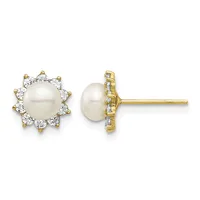Pair of gold stud earrings featuring white pearls surrounded by a halo of round white diamonds, shown from front and side views.