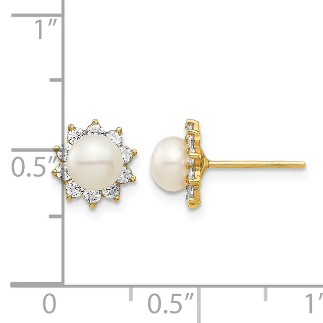 A pair of stud earrings featuring round white pearls surrounded by diamond halos in gold settings, displayed against a measurement scale.