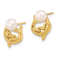 A pair of gold-toned earrings featuring white pearl studs set atop curved, sculpted gold settings with post and friction-back closures.